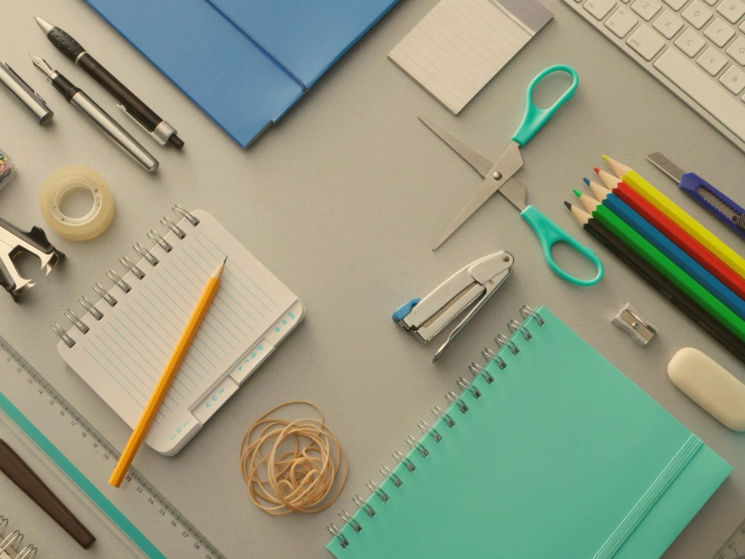 Daily business supplies including folders, pens, scissors, and desk organizers